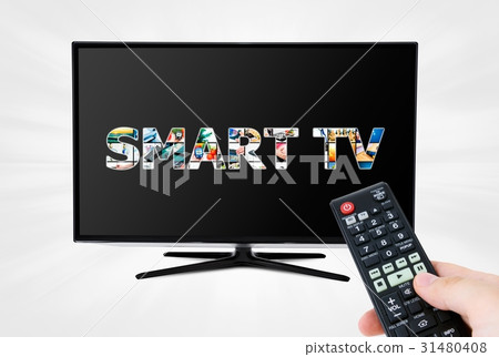 Hand with remote control aiming modern Smart TV 31480408