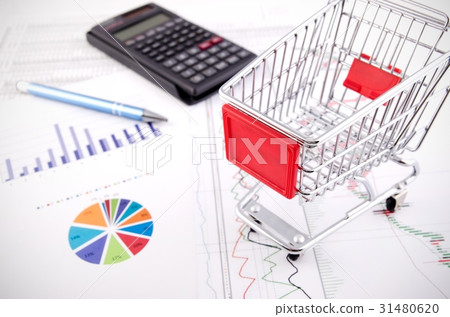 Shopping trolley toy on business documents Shopping trolley toy on business documents 31480620