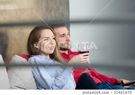 Couple enjoys free time and watching tv 31481870