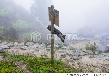 waymark on mountain path in misty spring day waymark on mountain path in misty spring day 31482014