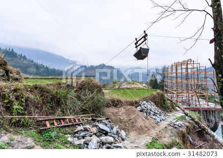 Building a new house on hill of Dazhai village Building a new house on hill of Dazhai village 31482073