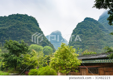 gardens in village in karst mountains valley 31482223