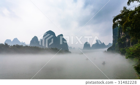 panoramic view of fog over river near Xingping 31482228