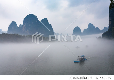 view of fog with ships on river near Xingping town 31482229