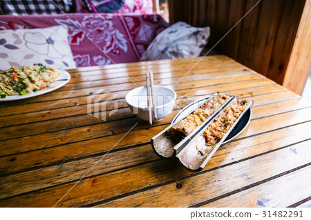 portion of rice served in bamboo trunk 31482291