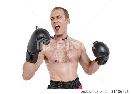 Boxer wearing medal performing boxing stance Boxer wearing medal performing boxing stance 31486776