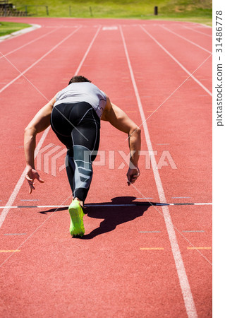 Athlete running on the running track Athlete running on the running track 31486778