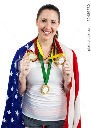 Athlete posing with gold medals after victory Athlete posing with gold medals after victory 31486780