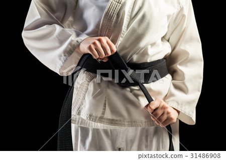 Fighter tightening karate belt 31486908