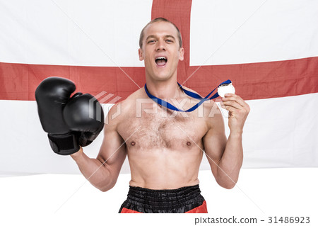 Excited boxer showing his gold medal Excited boxer showing his gold medal 31486923