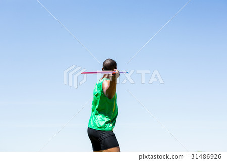 Athlete about to throw a javelin Athlete about to throw a javelin 31486926
