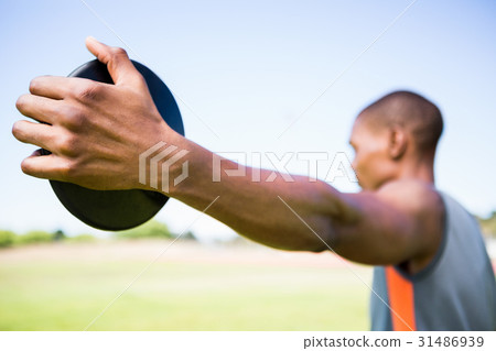 Athlete holding a discus 31486939