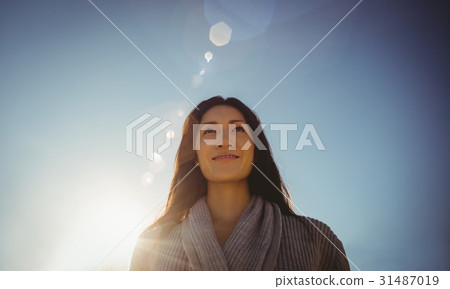 Woman standing at beach 31487019