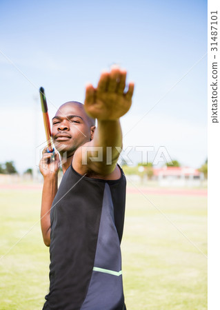 Athlete about to throw a javelin Athlete about to throw a javelin 31487101