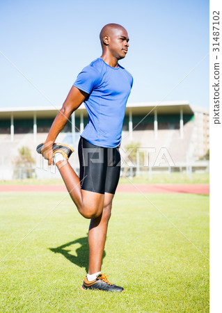 Athlete warming up in a stadium Athlete warming up in a stadium 31487102