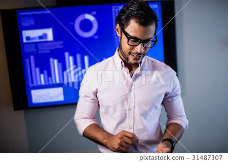 Businessman using a smartphone Businessman using a smartphone 31487307