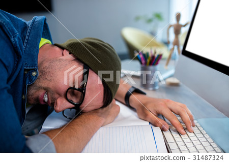 Hipster businessman sleeping at his desk 31487324