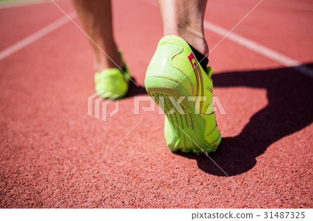 Athletes feet running on the racing track 31487325