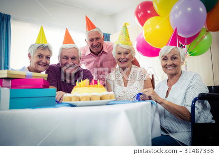 Group of seniors celebrating a birthday Group of seniors celebrating a birthday 31487336