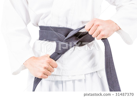 Fighter tightening karate belt 31487370
