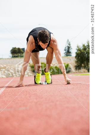 Athlete ready to start the relay race Athlete ready to start the relay race 31487452