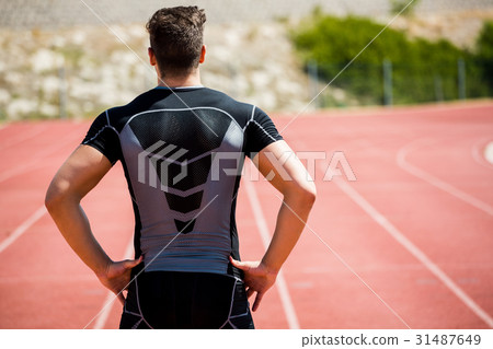 Athlete standing on running track 31487649