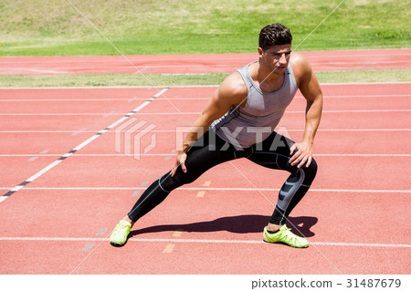 Athlete warming up on the running track Athlete warming up on the running track 31487679