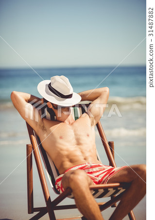 Man relaxing on armchair 31487882