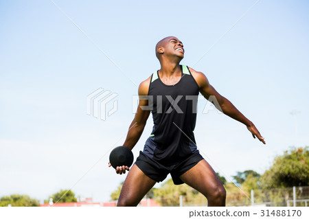 Athlete about to throw a discus Athlete about to throw a discus 31488170