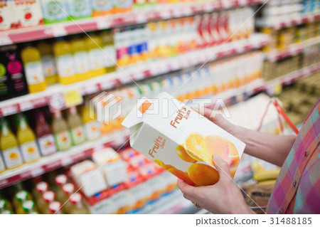 Close up view of hands holding fruits juice 31488185