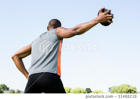 Athlete about to throw a discus Athlete about to throw a discus 31488218