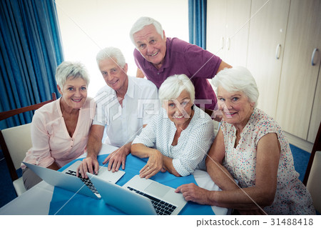 Group of seniors using a computer Group of seniors using a computer 31488418