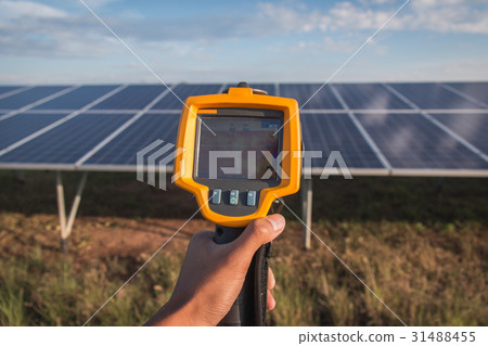 engineer using thermal imager to check temperature 31488455