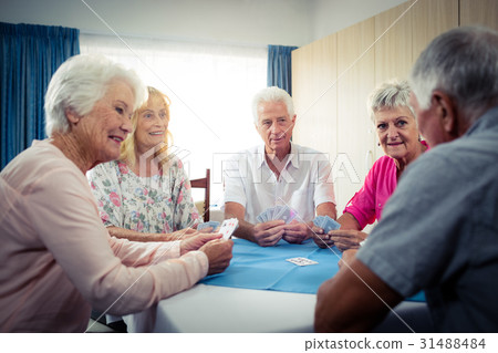 Group of seniors playing cards Group of seniors playing cards 31488484