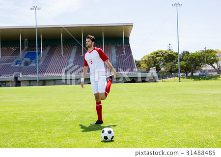 Football player warming up in stadium Football player warming up in stadium 31488485