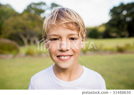Kid posing at camera during a sunny day 31488630