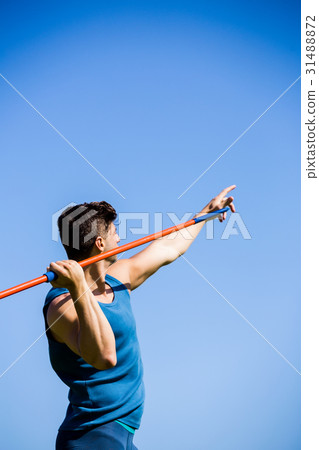 Athlete about to throw a javelin Athlete about to throw a javelin 31488872