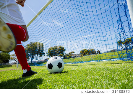 Football player scoring a goal 31488873