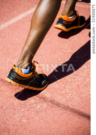 Athlete feet running on the running track 31488875