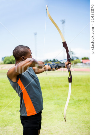 Athlete practicing archery Athlete practicing archery 31488876