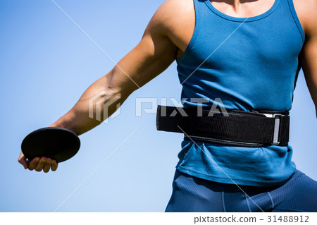 Athlete holding a discus Athlete holding a discus 31488912