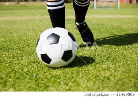 Female football player practicing soccer 31489009