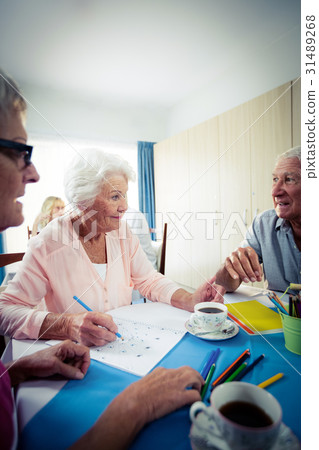 Group of seniors drawing and interacting Group of seniors drawing and interacting 31489268