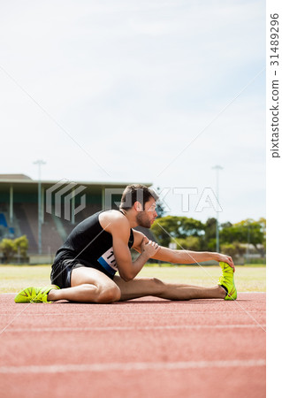 Athlete doing stretching exercise 31489296