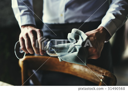 Restaurant Staff Wiping Glass on Table Setting Service for Reception Restaurant Staff Wiping Glass on Table Setting Service for Reception 31490568