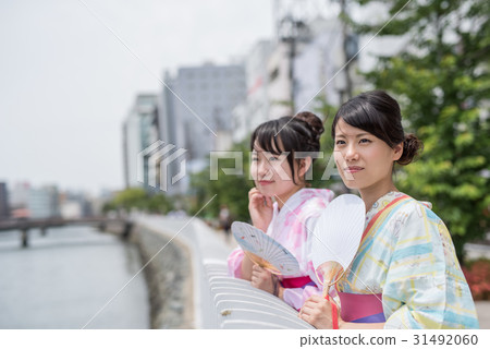 A woman walking around the city of Hakata with a yukata A woman walking around the city of Hakata with a yukata 31492060
