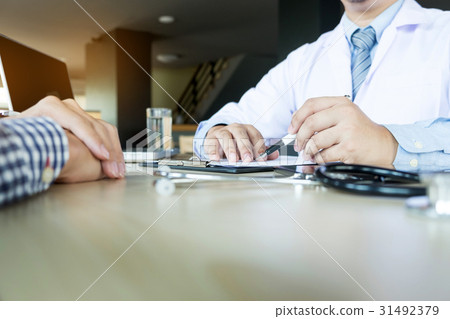 patient listening intently to a male doctor  31492379