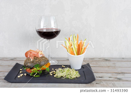 Healthy burger with hamon, tomatoes, micro greens 31493390