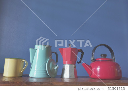 Retro zinc teapots on a wooden background 31501313