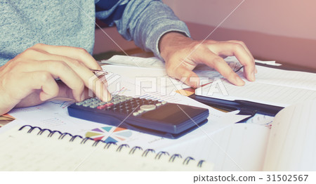 Young woman doing finance at home office 31502567